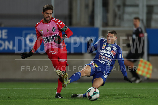 TSV Egger Glas Hartberg vs SV Oberbank Ried – Austrian Bundesliga Match | The image shows Andreas Leitner (Ried) becomes attack from Elias Havel (Hartberg), at the Bundesliga match TSV Hartberg vs SV Ried at Profertil Arena Hartberg. 22.11.2025