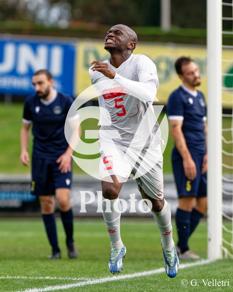 UEFA Region's Cup - Vaud v Bridge | Lamine Camara Mamadou (5 Vaud) scores his team's first goal during the UEFA Region's Cup game between Vaud and Bridge at Centre Sportif de Colovray in Nyon, Switzerland 