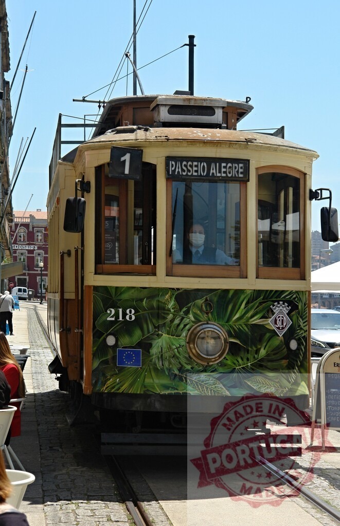 Porto vintage tram 1 moving along Passeio Alegre. Porto - Portugal | Classic electric tram 1 on tracks in Porto, Portugal, during the day - Realized with Pictrs.com