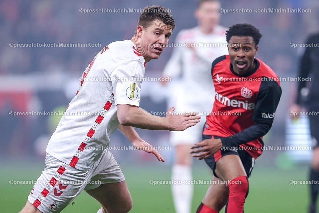 DFB05022502301 | 05.02.2025, Fußball, DFB-Pokal Viertelfinale, Bayer 04 Leverkusen - 1.FC Köln, BayArena, Saison 2024 2025: Dominique Heintz (FC Köln #3) im Zweikampf gegen Nathan Tella (Bayer04 Leverkusen #19)DFB regulations prohibit any use of photographs as image sequences and or quasi-video.