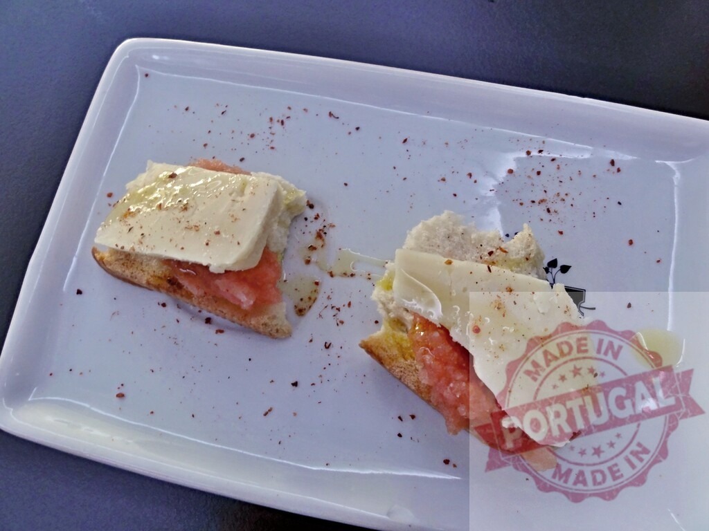 Gourmet tapas with cheese, guava paste, and bread | Small plate presenting two delicious gourmet tapas with cheese, guava paste, and bread - Realized with Pictrs.com