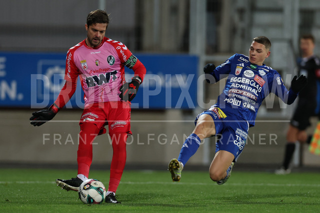 TSV Egger Glas Hartberg vs SV Oberbank Ried – Austrian Bundesliga Match | The image shows Andreas Leitner (Ried) becomes attack from Elias Havel (Hartberg), at the Bundesliga match TSV Hartberg vs SV Ried at Profertil Arena Hartberg. 22.11.2025