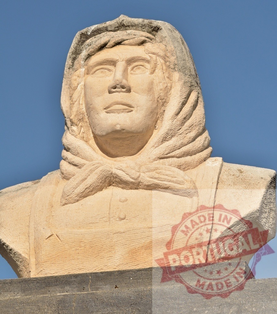 Stone bust of woman wearing headscarf against blue sky | Stone bust of a woman with a headscarf looking up against a clear blue sky - Realized with Pictrs.com