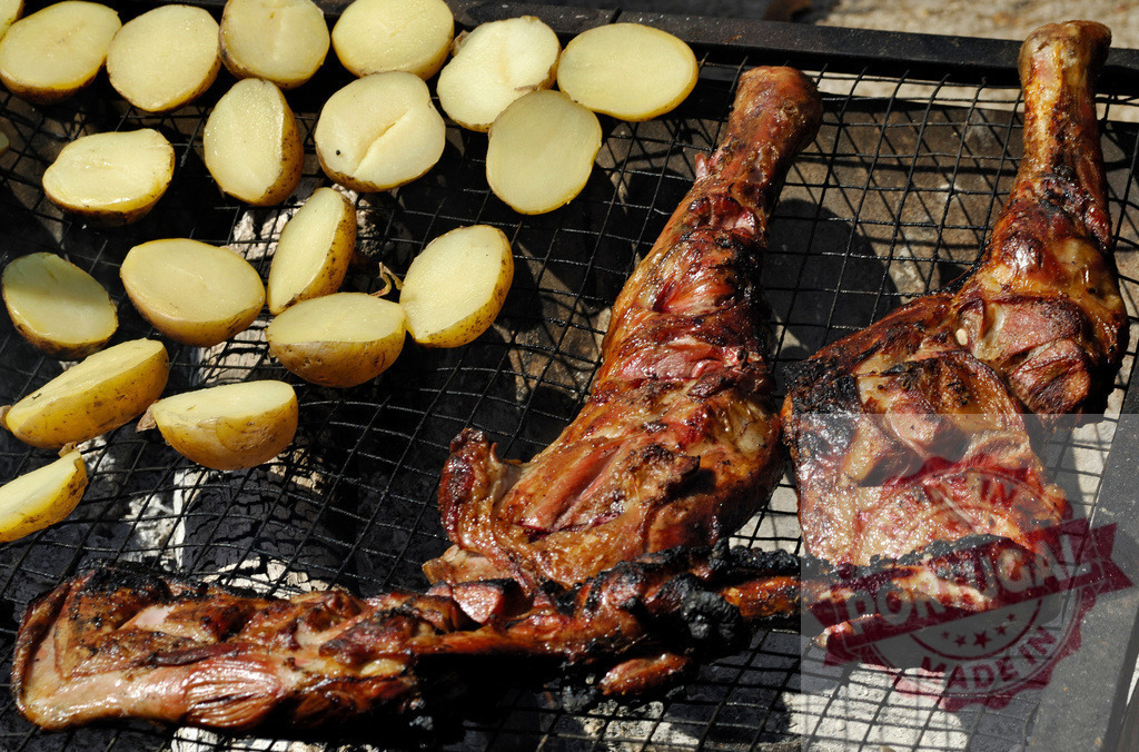 Grilling lamb leg cuts with potatoes on charcoal barbecue | Lamb leg cuts and boiled potatoes cooking deliciously on a hot barbecue grill - Realized with Pictrs.com