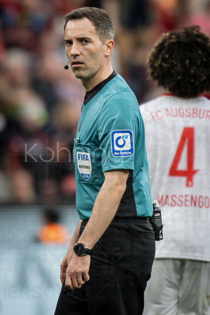 German Bundesliga, Bayer 04 Leverkusen vs. FC Augsburg, 18.04.2026 | LEVERKUSEN, GERMANY - APRIL 18, 2026 :  Referee Benjamin Brand (Schwebheim) during the German Bundesliga match on gameday 30 between Bayer 04 Leverkusen vs. FC Augsburg at BayArena on April 18, 2026 in Leverkusen, Germany. DFL REGULATIONS PROHIBIT ANY USE OF PHOTOGRAPHS AS IMAGE SEQUENCES AND/OR QUASI-VIDEO.