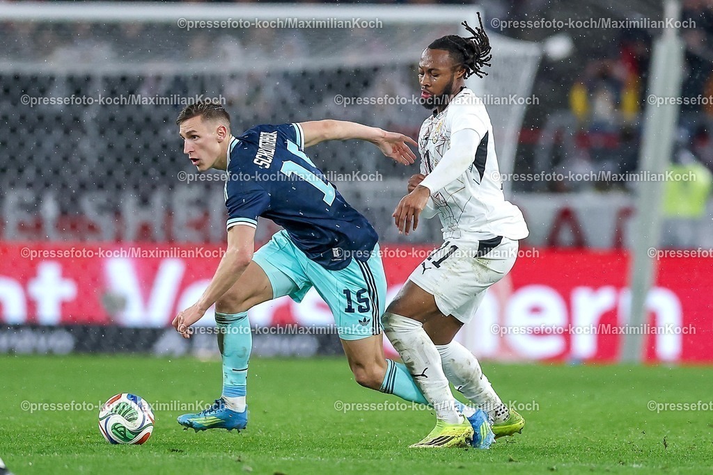 DFB30032600067 | 30.03.2026, Fußball, Länderspiel, Deutschland - Ghana, MHP-Arena (Stuttgart), Saison 2025 2026: Nico Schlotterbeck (GER #15) im Zweikampf gegen  Antoine Semenyo (Ghana #11)  DFB regulations prohibit any use of photographs as image sequences and or quasi-video.