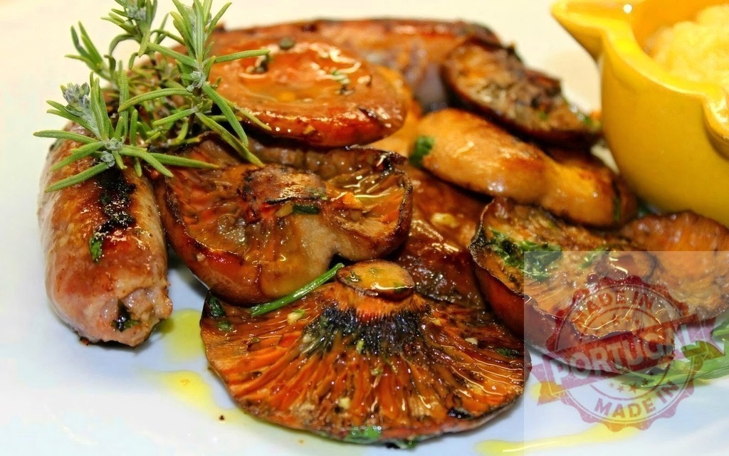 Grilled sausage and roasted mushrooms with fresh rosemary | Grilled sausage and roasted mushrooms with herbs, served on a white plate with sauce - Realized with Pictrs.com