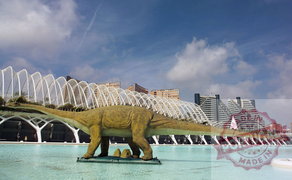 Iguanodon dinosaur model standing in the water of City of Arts and Sciences in Valencia | Iguanodon dinosaur model standing in artificial lake in front of modern buildings and futuristic architecture of City of Arts and Sciences in Valencia, Spain - Realized with Pictrs.com