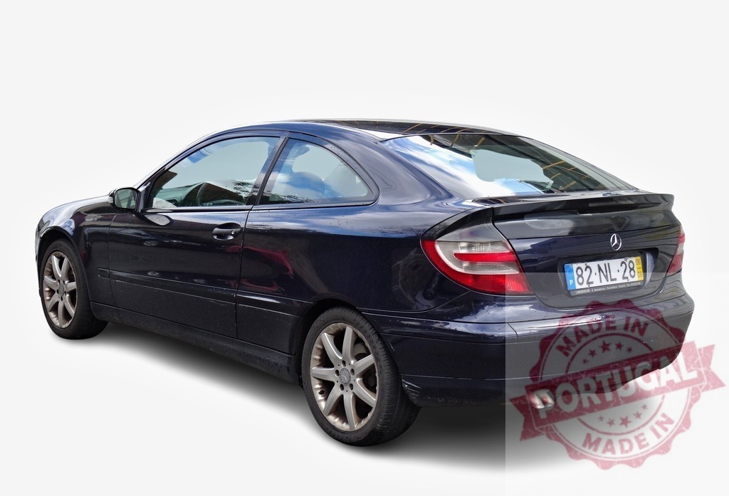 Mercedes-Benz C-Class Sportcoupe parked on white background | Dark blue Mercedes-Benz C-Class Sportcoupe C200 Kompressor Elegance showcasing its rear design - Realized with Pictrs.com