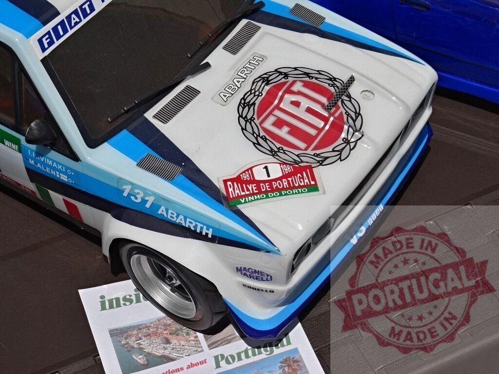 Fiat 131 Abarth participating in Rally de Portugal model car | Model car of a Fiat 131 Abarth with Rally de Portugal livery - Realisiert mit Pictrs.com
