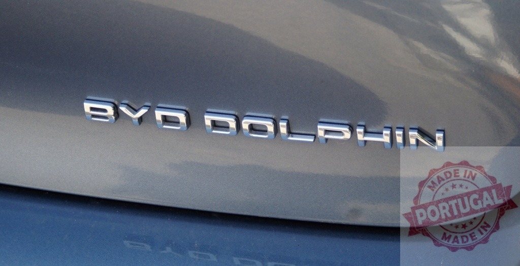 BYD Dolphin electric car chrome lettering branding | BYD Dolphin chrome lettering badge on the tailgate of an electric car - Realized with Pictrs.com