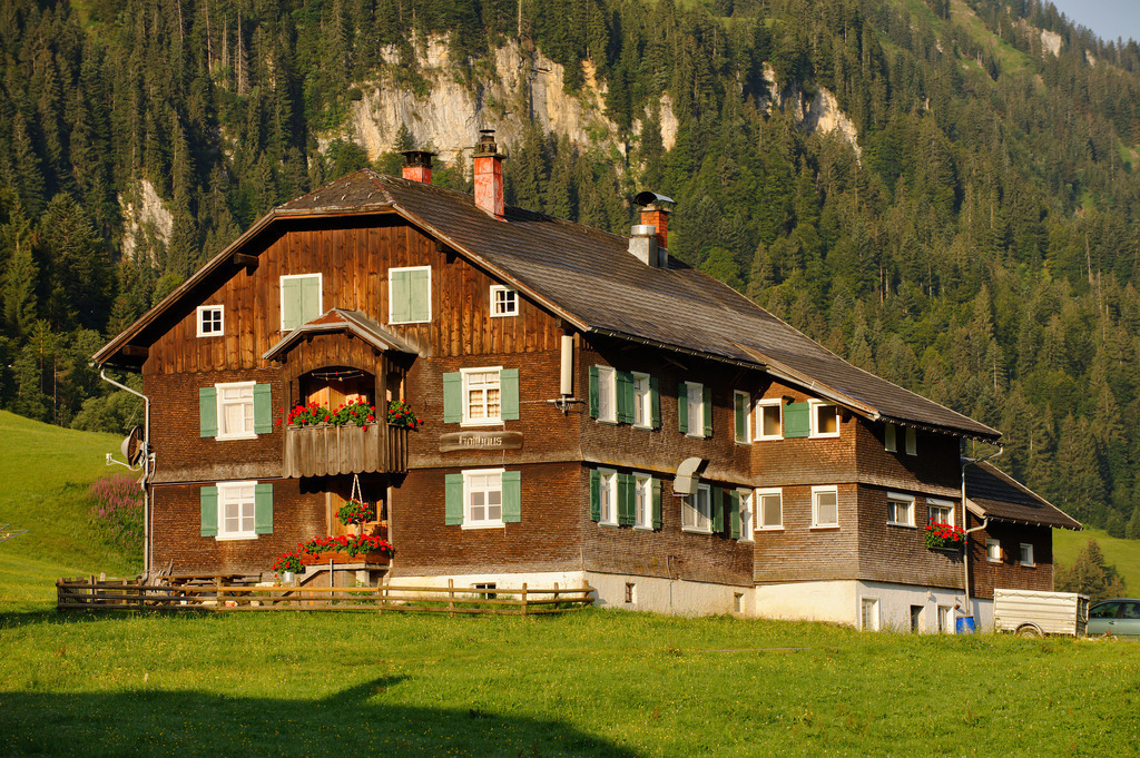 Bregenzerwälderhaus | Schoenenbach, Austria - July 24, 2012: Vorsäßsiedlung Schönenbach;  geschindeltes Bregenzerwälderhaus im Morgenlicht. - Realisiert mit Pictrs.com