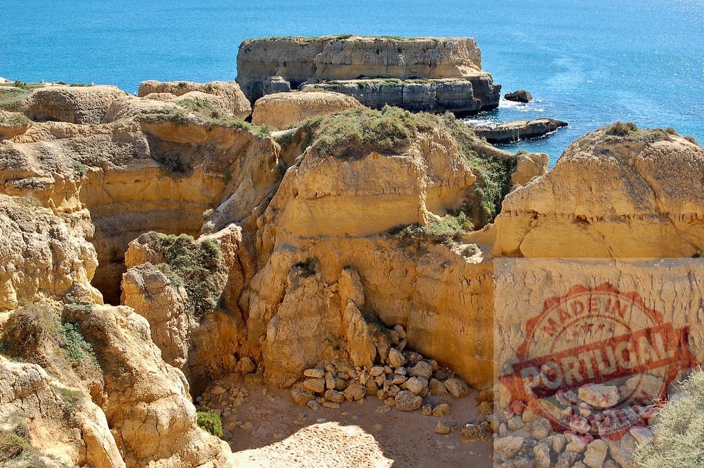 Algarve Coast rugged cliffs and ocean landscape | Rugged eroded sandstone cliffs meeting the Atlantic Ocean along the Portuguese coast - Realized with Pictrs.com