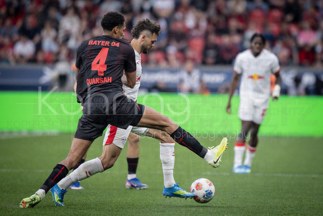German Bundesliga, Bayer 04 Leverkusen vs. RB Leipzig, 02.05.2026 | LEVERKUSEN, GERMANY - MAY 2, 2026 :  Jarell Quansah (Bayer 04 Leverkusen, 4), Max Finkgraefe (Finkgrafe, Finkgräfe, RB Leipzig, 35) during the German Bundesliga match on gameday 32 between Bayer 04 Leverkusen vs. RB Leipzig at BayArena on May 2, 2026 in Leverkusen, Germany. DFL REGULATIONS PROHIBIT ANY USE OF PHOTOGRAPHS AS IMAGE SEQUENCES AND/OR QUASI-VIDEO.