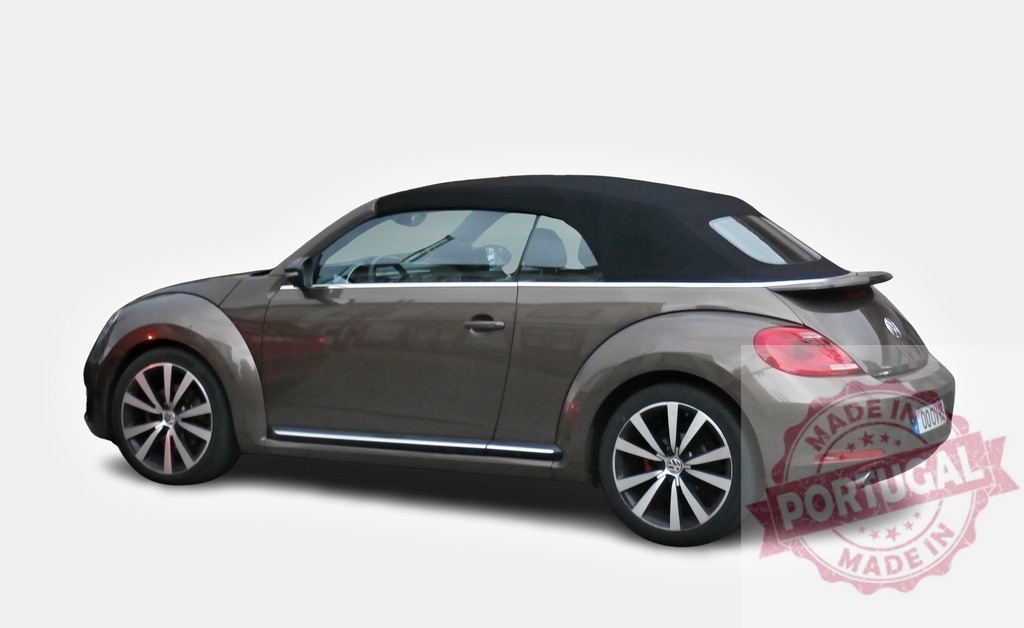 Volkswagen Beetle convertible car parked on white background | Modern Volkswagen Beetle convertible car with closed soft top parked on white background - Realized with Pictrs.com