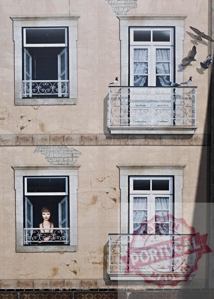 Lisbon building facade artwork with trompe-l'oeil mural | Trompe-l'oeil mural painting on a building facade with a woman, windows, balconies, and pigeons - Realized with Pictrs.com