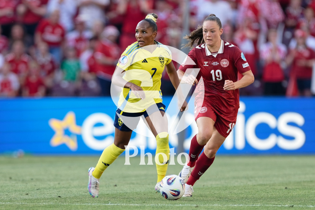 Denmark v Sweden - UEFA Women's EURO 2025 Group C | GENEVA, SWITZERLAND - JULY 4: Madelen Janogy of Sweden (L) runs with the ball under pressure from Janni Thomsen of Denmark (R) during the UEFA Womens EURO 2025 Group C match between Denmark and Sweden at Stade de Geneve on July 4, 2025 in Geneva, Switzerland. (Photo by Giuseppe Velletri/Sports Press Photo/Getty Images)