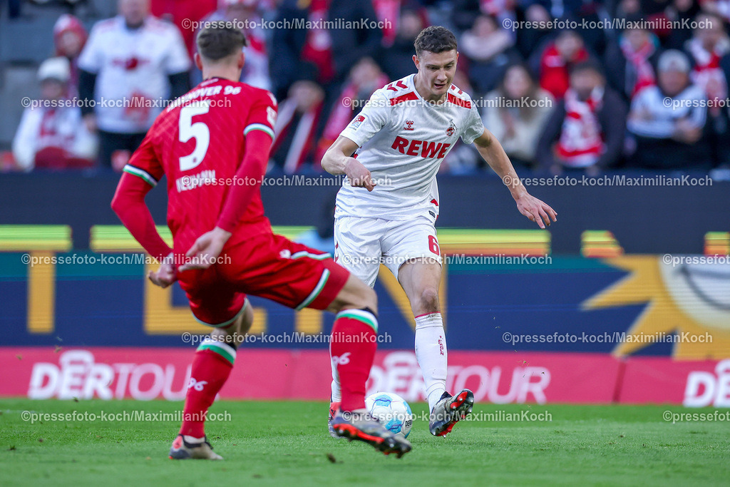 1FC30112402130 | 30.11.2024, Fußball, 1. FC Köln - Hannover 96, 2. Fußball Bundesliga, RheinEnergieSTADION, Saison 2024 2025: Phil Neumann (Hannover #5) gegen Eric Martel (1.FC Köln #6)DFB regulations prohibit any use of photographs as image sequences and or quasi-video.
