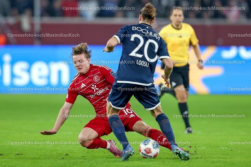 F9527022601060 | 27.02.2026, Fußball, Fortuna Düsseldorf - VfL Bochum, 2. Fußball Bundesliga, Merkur Spiel-Arena, Saison 2025 2026: Christian Rasmussen&nbsp;(Fortuna Düsseldorf #10) im Zweikampf gegen  Noah Loosli&nbsp;(VfL Bochum #20)  DFB regulations prohibit any use of photographs as image sequences and or quasi-video.