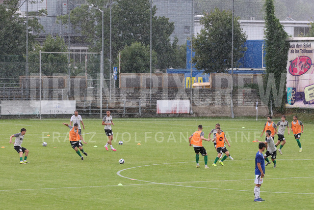 Friendly Match: SC Weiz vs TSV Hartberg in Weiz | Weiz, AUSTRIA, 01.JUL.26 - SOCCER - ADMIRAL Bundesliga, SC Weiz vs TSV Hartberg, test match. The image shows heavy rain during warm up from SC Weiz.