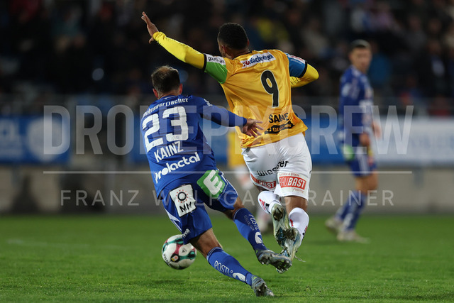 TSV Egger Glas Hartberg vs SV Oberbank Ried – Austrian Bundesliga Match | The image shows Tobias Kainz (Hartberg) make a foul on Saliou Sane (Ried), at the Bundesliga match TSV Hartberg vs SV Ried at Profertil Arena Hartberg. 22.11.2025