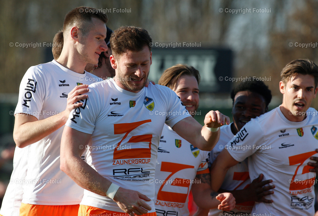 A_LUI_18032023_07 | SPORT,FUSSBALL,LT1 OOE LIGA ASKOE OEDT-SPG WALLERN/ST.MARIENKIRCHNEN 18.03.2023 IM BILD: TORSCHUETZE ZUM 1:0 ALFONS DIEPLINGER  (IN DER MITTE SPGWALLERN) FOTO:FOTOLUI