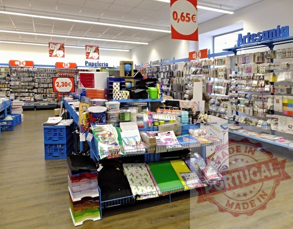 Retail store interior selling stationery and craft supplies | Bright interior of a discount retail store with shelves full of stationery and craft items - Realized with Pictrs.com