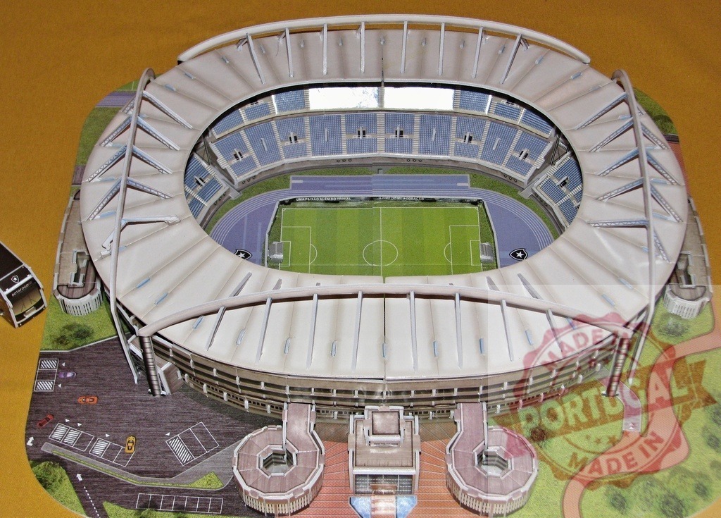 Scale model of soccer stadium with running track and parking lot | Overhead view of a stadium scale model with a soccer field, running track and parking lot - Realisiert mit Pictrs.com