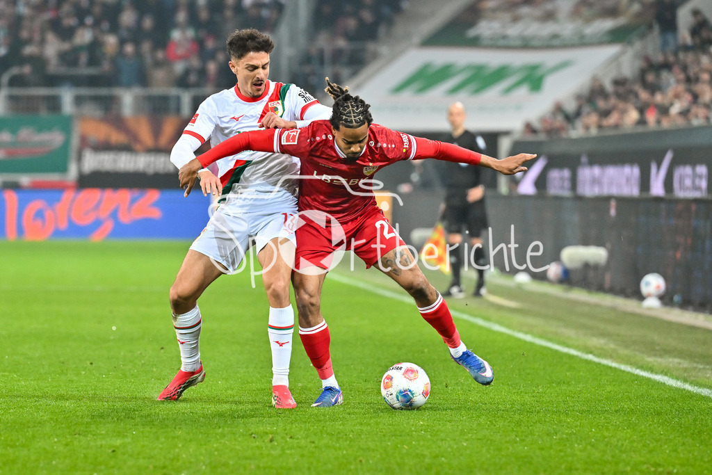 FC Augsburg - VfB Stuttgart | AUGSBURG, GERMANY - 22. MAERZ: im Duell Dimitrios GIANNOULIS (FC Augsburg 13) und Lorenz ASSIGNON (VfB Stuttgart 22) während dem Bundesligamatch zwischen dem FC Augsburg und dem VfB Stuttgart am 27. Spieltag in der WWK Arena / DFL REGULATIONS PROHIBIT ANY USE OF PHOTOGRAPHS AS IMAGE SEQUENCES AND/OR QUASI-VIDEO