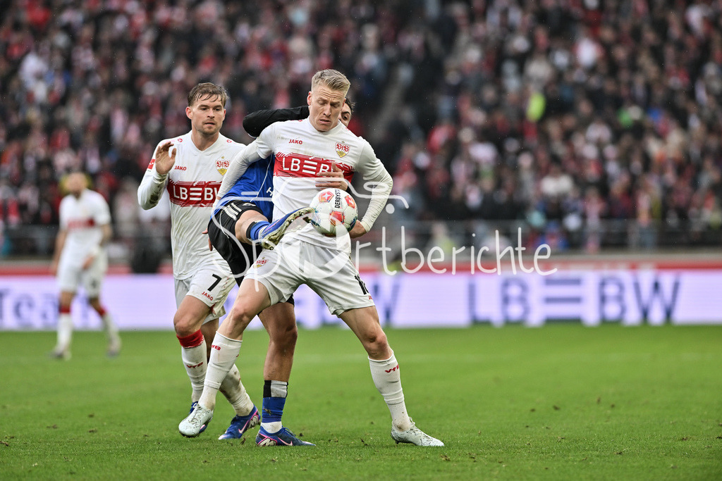 VfB Stuttgart - Hamburger SV | STUTTGART, GERMANY - 12. APRIL: tackle between William MIKELBRENCIS (Hamburger SV 2) and Chris FÜHRICH (VfB Stuttgart 10) during the Bundesliga Match between VfB Stuttgart vs. Hamburger SV on Matchday 29 at MHP Arena / DFL REGULATIONS PROHIBIT ANY USE OF PHOTOGRAPHS AS IMAGE SEQUENCES AND/OR QUASI-VIDEO