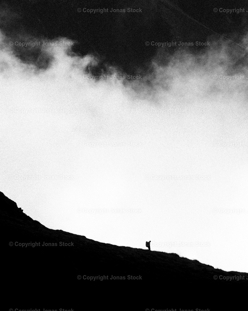 Cloud Hike | A hiker making his way down the hill through the clouds in Austria.  - Realisiert mit Pictrs.com
