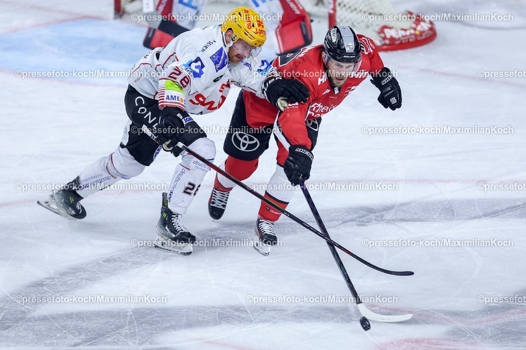 KEC24032501060 | 24.03.2025, Eishockey, DEL Play-offs, Kölner Haie - Fischtown Pinguins Bremerhaven, Viertelfinale Spiel 4, Lanxess-Arena Köln: Marly Quince (Fischtown Pinguins #28) im Zweikampf gegen Parker Tuomie (Kölner Haie #62) 