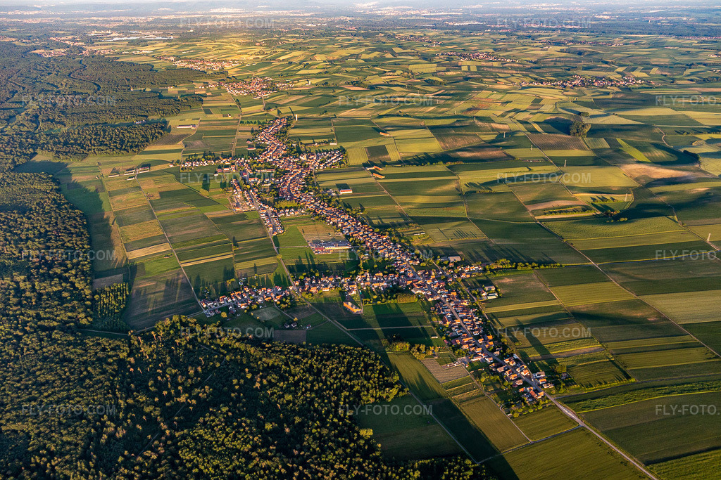 Aerial view: View of the longest village in Alsace in Schleithal in the state Bas-Rhin, France. – Photo: IMG_115551.jpg taken on 06/16/2019 by Werner Riehm/FLY-FOTO.com – Resolution of the original: 5275 x 3517 px