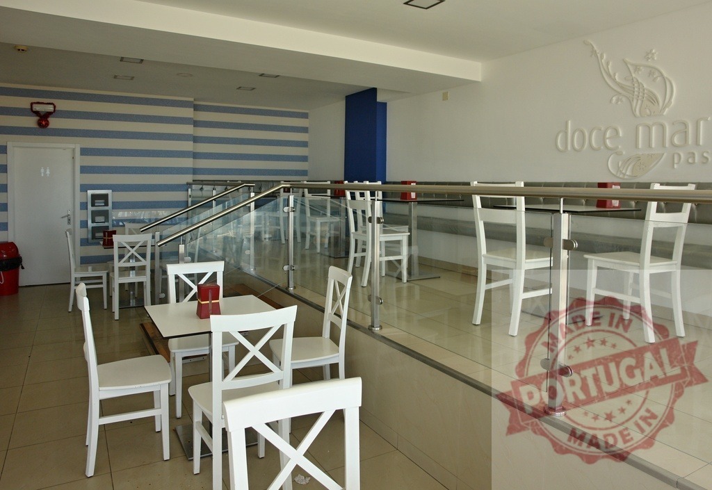 Empty cafe interior with white chairs and blue stripes | Empty modern cafe or restaurant interior with contemporary design and white wooden chairs - Realized with Pictrs.com