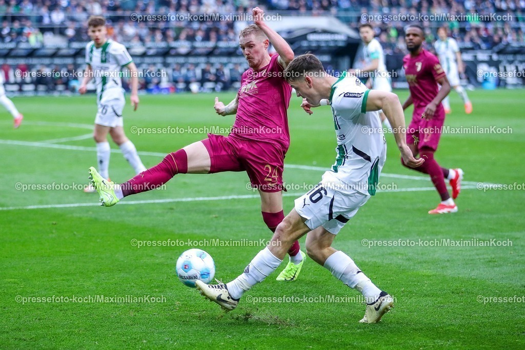 BMG21022501042 | 22.02.2025, Fußball, Borussia Mönchengladbach - FC Augsburg, 1. Fußball Bundesliga, Borussia-Park, Saison 2024 2025: Fredrik Jensen (FC Augsburg #24) im Zweikampf gegen Philipp Sander (Mönchengl. #16)DFB regulations prohibit any use of photographs as image sequences and or quasi-video.