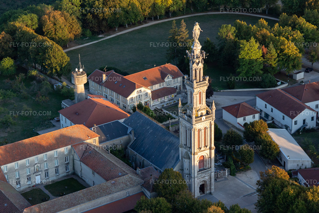 Aerial view: Statue of Mary on the tower of the Basilique Notre-Dame de Sion on the pilgrimage hill Site de la Colline de Sion-Vaudémont in Saxon-Sion in the state Meurthe et Moselle, France. – Photo: IMG_117950.jpg taken on 09/14/2019 by Werner Riehm/FLY-FOTO.com – Resolution of the original: 4912 x 3274 px