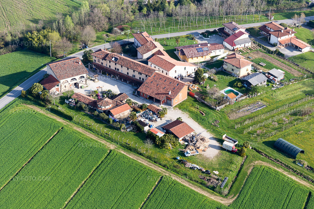 Aerial view: View of the town in Colle in the state Friuli Venezia Giulia, Italy. – Photo: IMG_105734.jpg taken on 04/08/2018 by Werner Riehm/FLY-FOTO.com – Resolution of the original: 5472 x 3648 px
