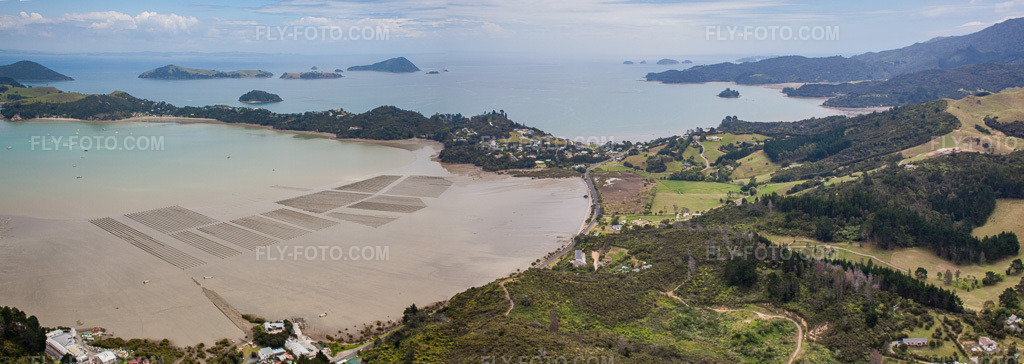 Aerial view: Panorama of the coastal landscape on the sandy beach of the South Pacific in the McGreogor Bay district in Coromandel in the state Waikato, New Zealand.Photo: IMG_55489-Bearbeitet.jpg taken on 01/12/2013 by Werner Riehm/FLY-FOTO.comResolution of the original: 8275 x 2940 px