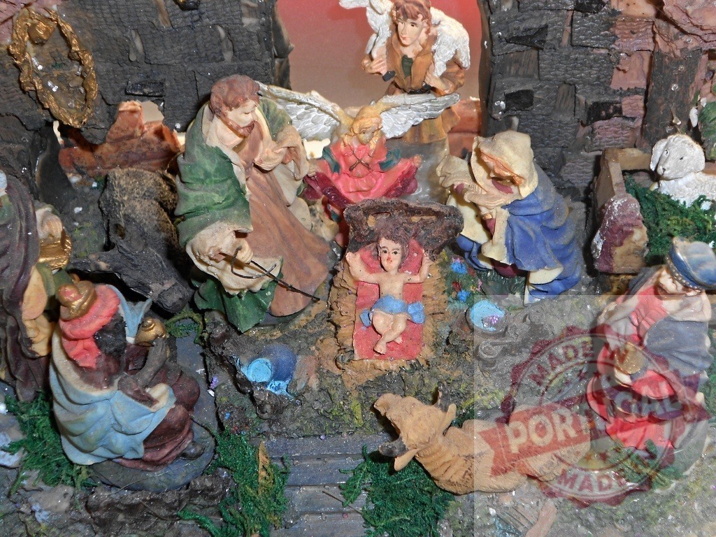 Nativity scene depicting the birth of Jesus with Mary, Joseph, the Three Wise Men, and an angel | Small colorful nativity scene figurines celebrating the birth of Jesus Christ, featuring Mary, Joseph, the Three Wise Men, shepherds, angels, and animals - Realized with Pictrs.com