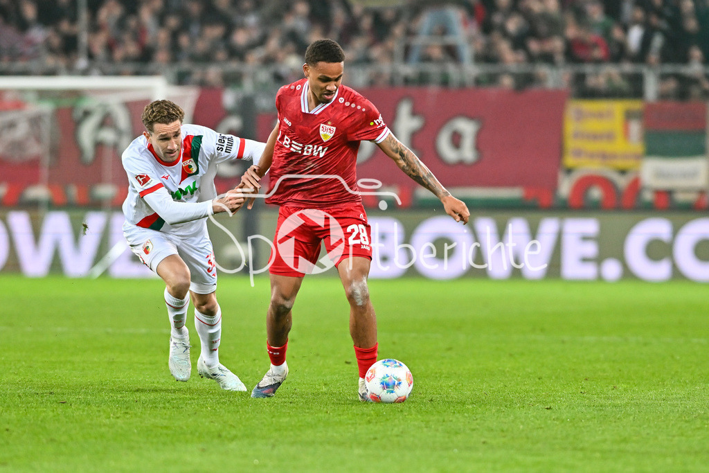 FC Augsburg - VfB Stuttgart | AUGSBURG, GERMANY - 22. MAERZ: im Duell Arthur CHAVES (FC Augsburg 34) und Nikolas NARTEY (VfB Stuttgart 28) während dem Bundesligamatch zwischen dem FC Augsburg und dem VfB Stuttgart am 27. Spieltag in der WWK Arena / DFL REGULATIONS PROHIBIT ANY USE OF PHOTOGRAPHS AS IMAGE SEQUENCES AND/OR QUASI-VIDEO
