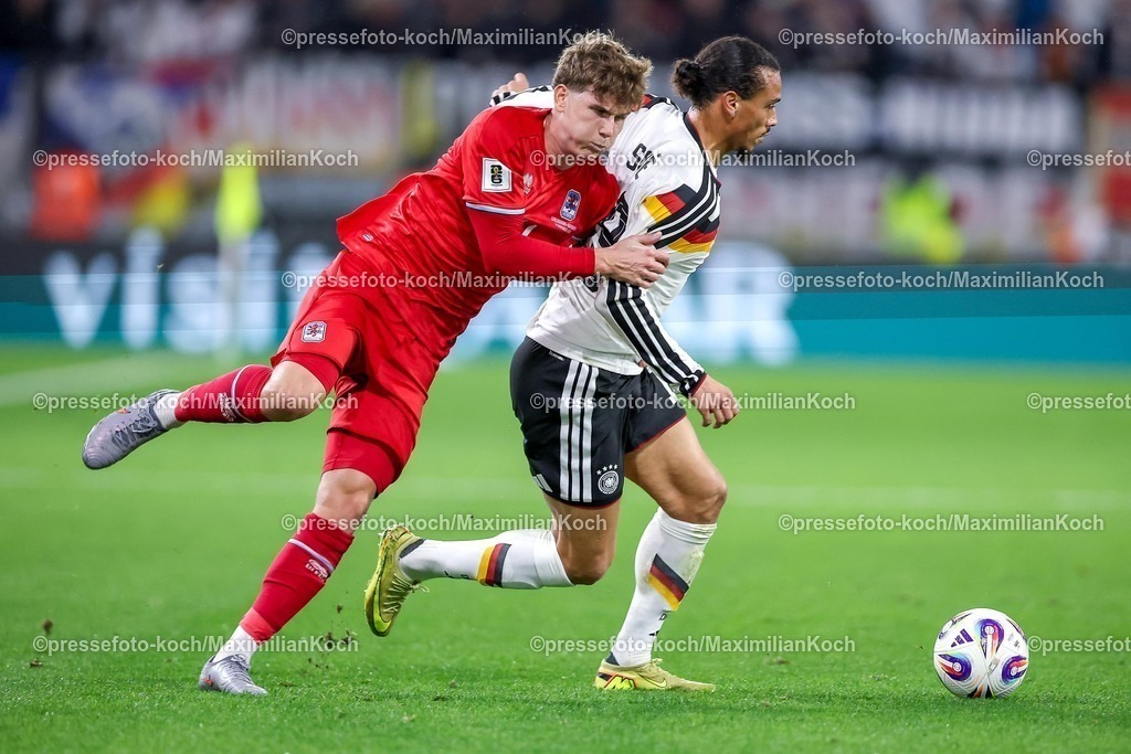 DFB14112501095 | 14.11.2025, Fußball, Länderspiel, WM-Qualifikation Europa, Deutschland - Luxemburg, Stade de Luxembourg (Croix de Gasperich, Luxemburg), 9. Spieltag, Saison 2025 2026: Florian Bohnert (LUX #04) im Zweikampf gegen  Leroy Sane (GER #19)  Regulations prohibit any use of photographs as image sequences and or quasi-video.