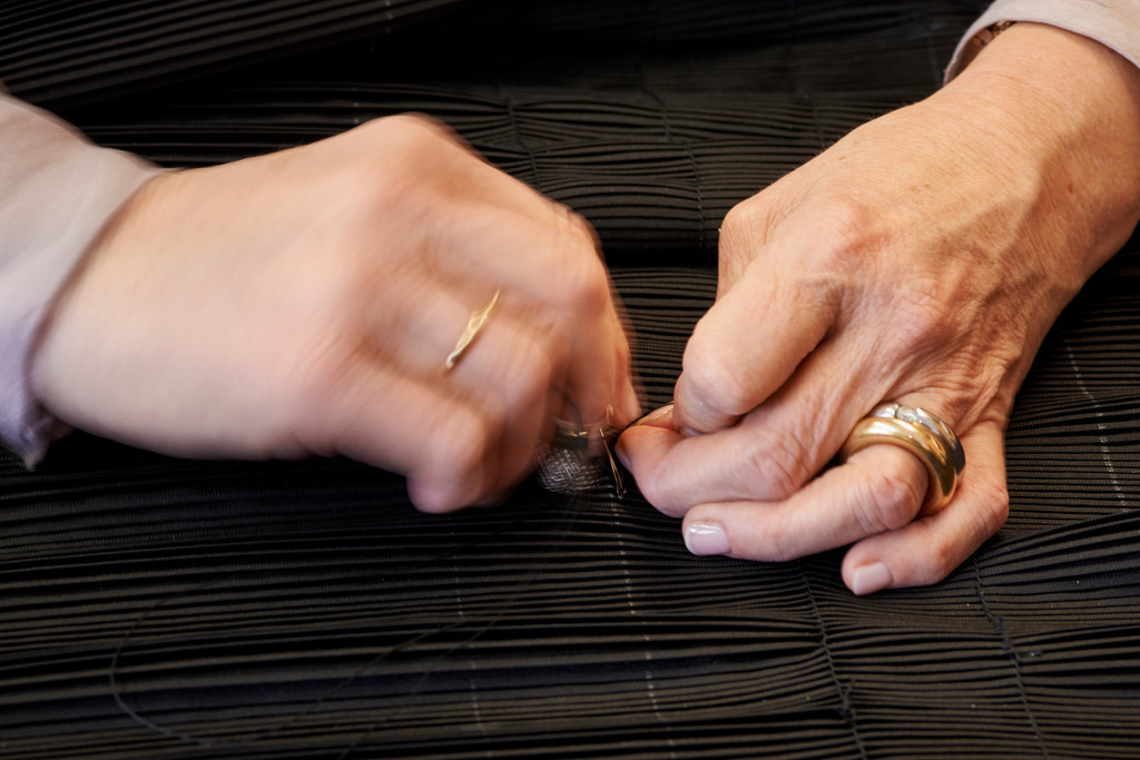 Juppo und Emlmachare | Bezau, Austria - March 09, 2016: Juppo und Emlmachare; die Juppe wird genäht. - Realisiert mit Pictrs.com