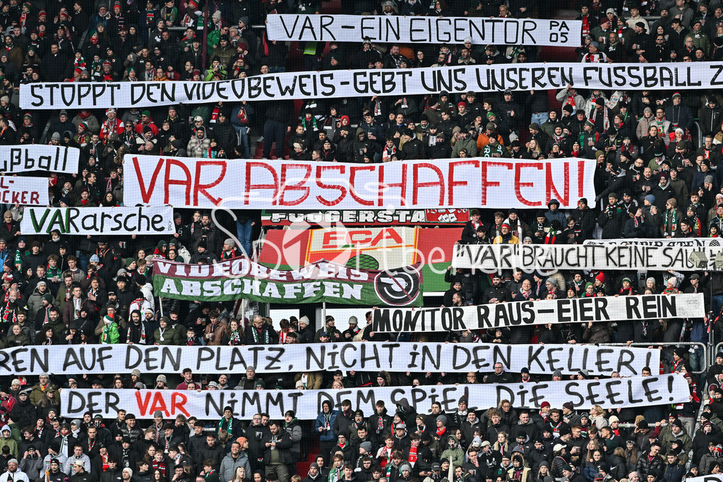 FC Augsburg - 1. FC Heidenheim | AUGSBURG, GERMANY - 15. FEBRUARY: Fans der Augsburger zeigen zu Spielbeginn Spurchbänder / VAR Abschaffen / Symbolbild / Symbolfoto / während dem Bundesligamatch zwischen dem FC Augsburg und dem 1. FC Heidenheim am 22. Spieltag in der WWK-Arena / DFL REGULATIONS PROHIBIT ANY USE OF PHOTOGRAPHS AS IMAGE SEQUENCES AND/OR QUASI-VIDEO