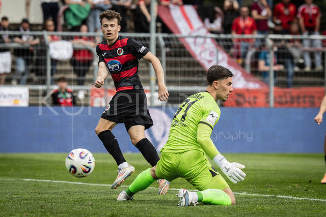 Viktoria Koeln vs. SV Wehen Wiesbaden, 11.04.2026 | KOELN, GERMANY - APRIL 11, 2026:  Lucas Wolf (Viktoria Köln, 21, on the left) scoring his team's second goal during the 3rd division match between Viktoria Koeln vs. SV Wehen Wiesbaden at the Sportpark Hoehenberg on matchday 7 on April 11, 2026 in Koeln, Germany. DFL REGULATIONS PROHIBIT ANY USE OF PHOTOGRAPHS AS IMAGE SEQUENCES AND/OR QUASI-VIDEO.