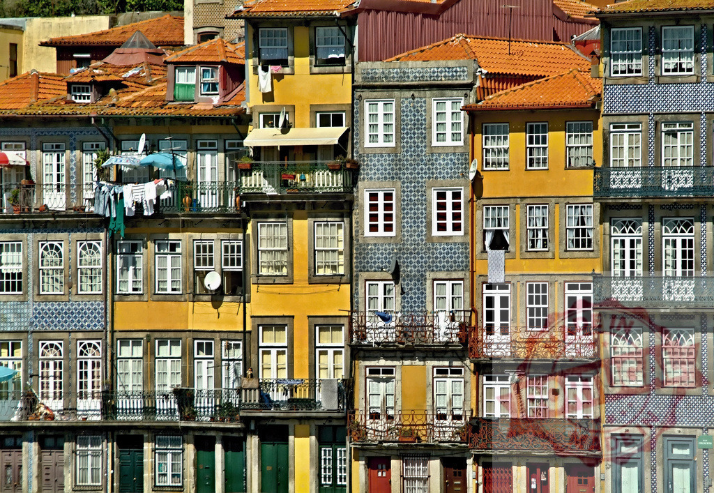 Porto Ribeira district facades with traditional azulejo tiles | Colorful historic buildings in Porto, Portugal, featuring traditional azulejo tiles and terracotta roofs - Realized with Pictrs.com