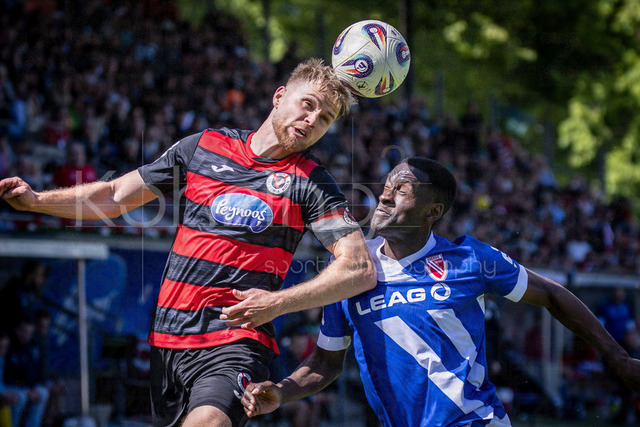 German 3rd Division, Viktoria Koeln vs. Energie Cottbus, 26.04.2026 | KOELN, GERMANY - APRIL 26, 2026:  Lars Dietz (FC Viktoria Koeln, 2) and Merveille Biankardi (Energie Cottbus, 37) during a header duel during the 3rd division match on gameday 35 between Viktoria Koeln vs. Energie Cottbus at the Sportpark Hoehenberg on April 26, 2026 in Koeln, Germany. DFL REGULATIONS PROHIBIT ANY USE OF PHOTOGRAPHS AS IMAGE SEQUENCES AND/OR QUASI-VIDEO.