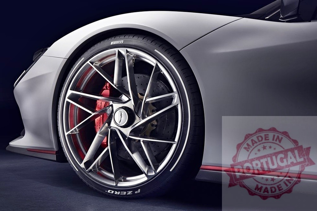 Pininfarina Battista hypercar wheel and brake detail | Pininfarina Battista electric hypercar wheel showing Pirelli P Zero tire and red brake calipers - Realisiert mit Pictrs.com