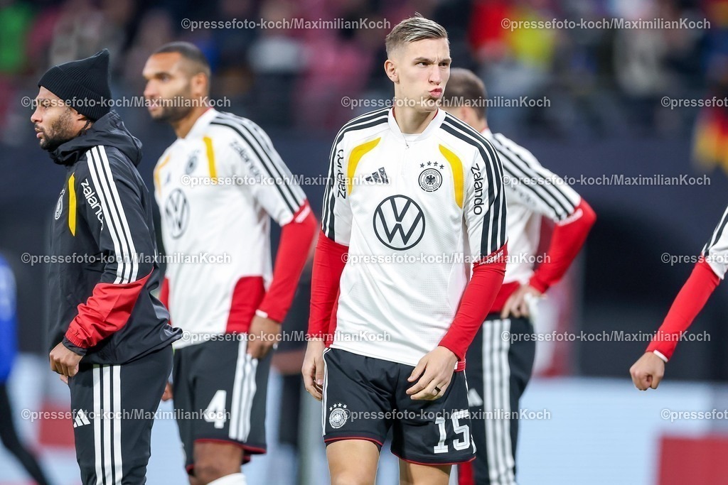 DFB17112501047 | 17.11.2025, Fußball, Länderspiel, WM-Qualifikation Europa, Deutschland - Slowakei, Red Bull Arena (Leipzig), 10. Spieltag, Saison 2025 2026: Nico Schlotterbeck (GER #15)  beim Aufwärmen Training vor dem Spiel Regulations prohibit any use of photographs as image sequences and or quasi-video.