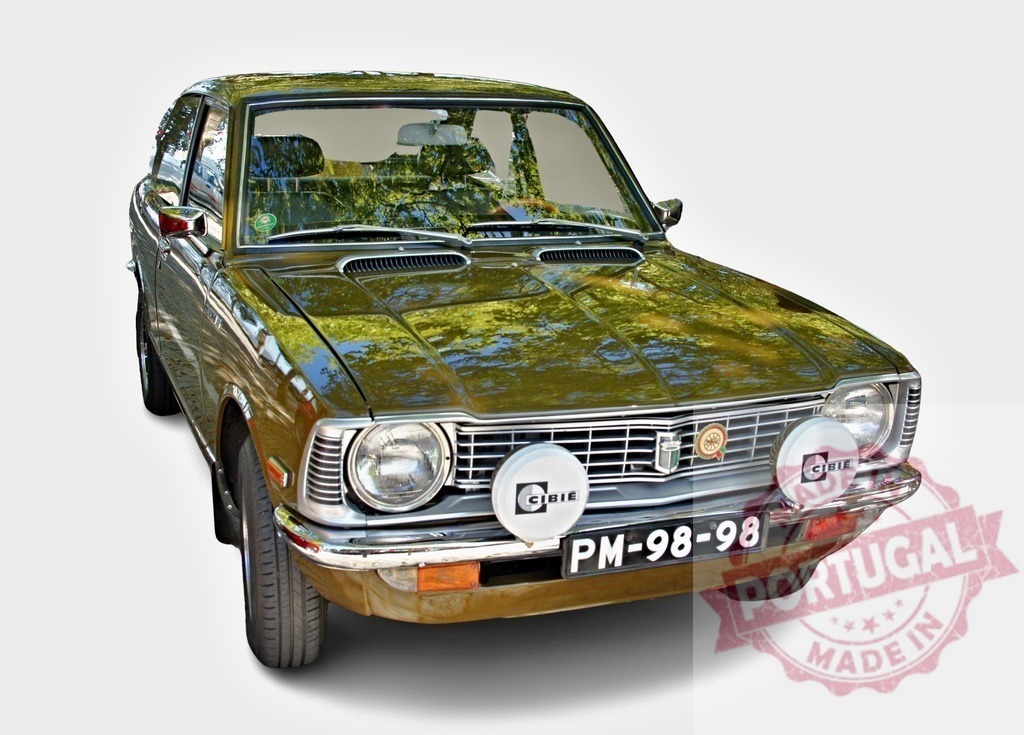 Classic Toyota Corolla parked, reflecting surrounding trees | Vintage Toyota Corolla showcasing its iconic design and the reflection of trees on its polished surface - Realized with Pictrs.com