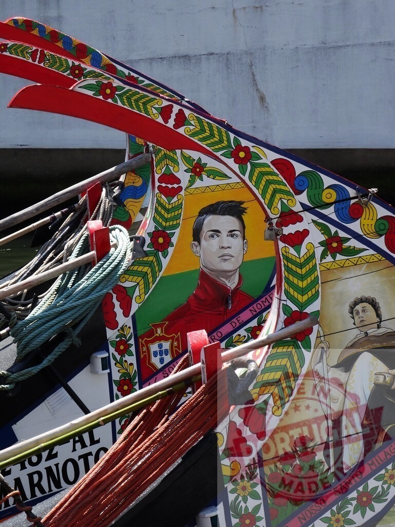 Moliceiro boat with Cristiano Ronaldo painting in Aveiro. Aveiro - Portugal | Traditional Moliceiro boat prow displaying Cristiano Ronaldo portrait and folk art in Aveiro - Realized with Pictrs.com